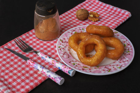 turkish donut ( lokma ) on the plate isolated
