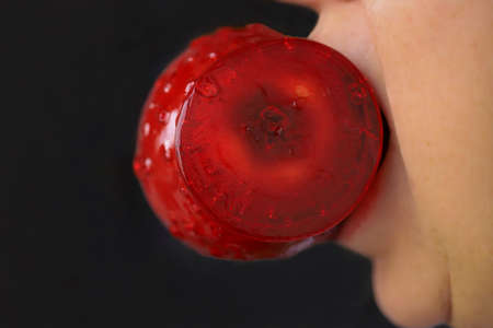 Plate with delicious candy apples on black backgroundの写真素材