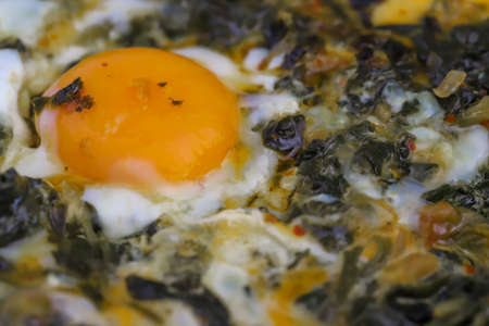 keto diet. Healthy omelet with spinach. Eggs with spinach in a frying pan.