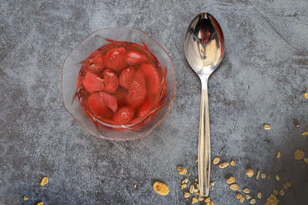 Sweet refreshing strawberry compote with ripe strawberries in a small bowl