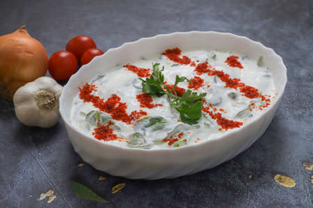 Purslane salad with yogurt in a white plateの写真素材
