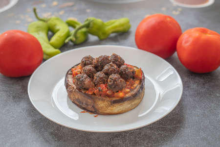 Meatballs on round eggplant. Eggplant dish with meatballsの写真素材