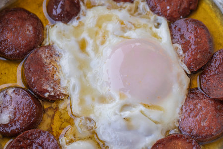 Turkish Sausage (sausage) and eggs. Sausage Fried Egg, egg with bacon from top view, sausage with egg omelette.の写真素材