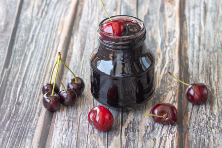 Jars with fresh homemade cherry jamの写真素材