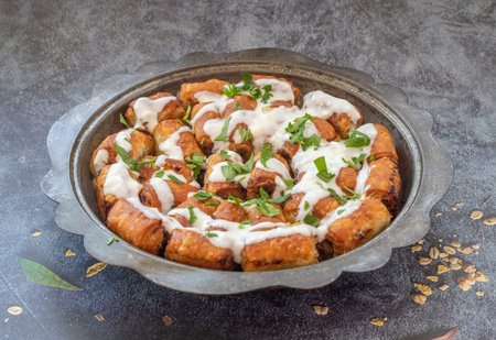 Traditional Bosnian pastry with minced meat (minced meat) in a metal plate. English name; Bosnian dumplings.の写真素材