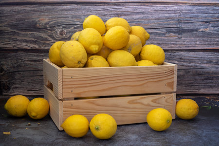 Freshly Picked Lemons in a Wooden Caseの写真素材