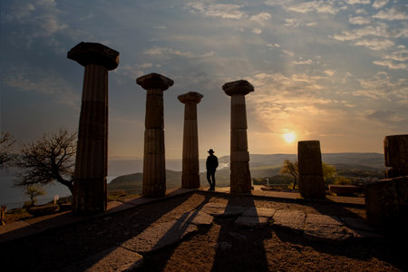 The ruins of the Temple of Athena in the ancient city of Assos. sunset landscape. Canakkale, Turkeyの写真素材