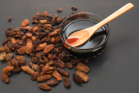 Grape molasses and fresh organic grapesの写真素材