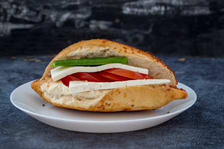 Izmir Kumru cold sandwich, tomato, pepper, cheese and sesame bread.