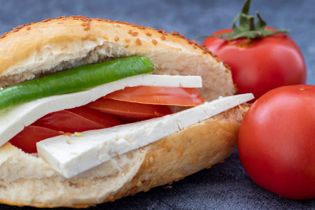 Izmir Kumru cold sandwich, tomato, pepper, cheese and sesame bread.の写真素材