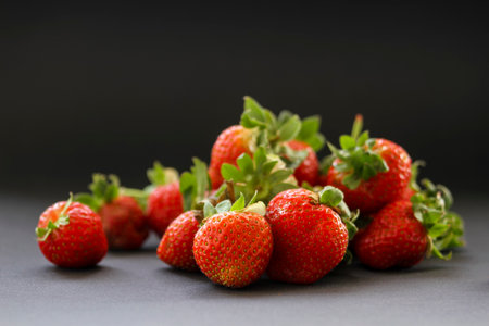 Fresh, red strawberries on a black backgroundの写真素材