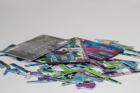 Izmir - Turkey ;circa 2022 . a pile of old expired credit card shredded, isolated on white - protection against identity theft conceptのeditorial素材