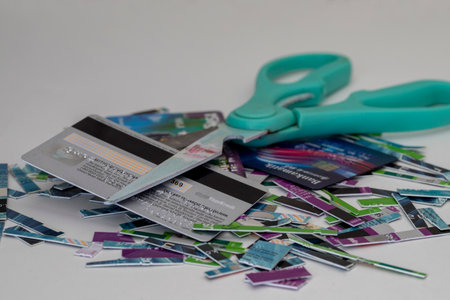 Izmir - Turkey ;circa 2022 . a pile of old expired credit card shredded, isolated on white - protection against identity theft conceptのeditorial素材