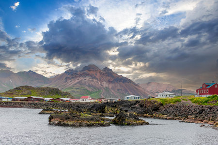 Iceland -Borgarfjordur Eystri i; The village is located in a small bay surrounded by magnificent mountain peaks.の写真素材