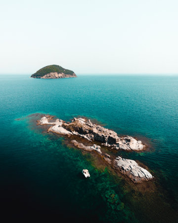 Aerial view of a rocky island in the middle of the sea, Greece.
