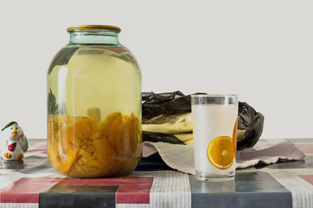 Apricot Compote with a glass and Caucasian bread on a rustic tableの写真素材