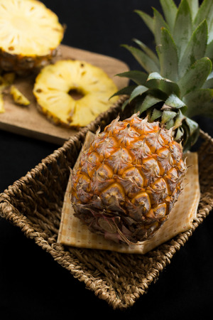 pineapple ftuit and slices on the table.の写真素材