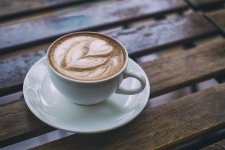 Hot Mocca offee on a wooden table background,Film toneの写真素材