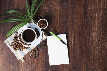 coffee cup and beans on the wood background.の写真素材
