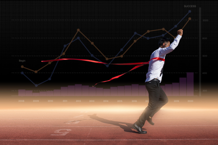 Successful businessman in a finish line. Concept of Successfulの写真素材