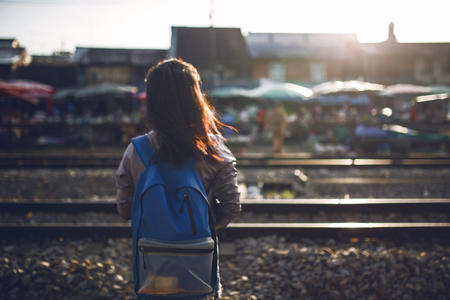 traveler standing away on railroad in the moring.の写真素材