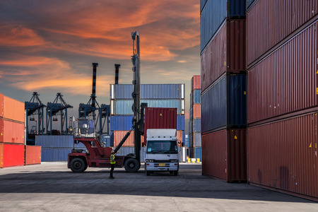 Foreman control loading Containers box to truck for Logistic Import Export Background, Business logistic concept, import and export conceptの写真素材