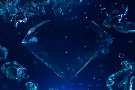 Photo of a blue diamond in water with bubbles floating.の写真素材