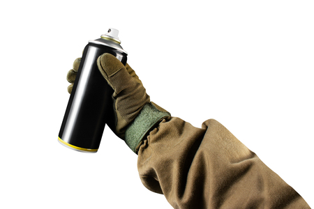 First person view military hand in tactical jacket and gloves holding paint spray can.の写真素材