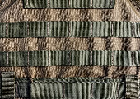Photo of a military armor vest molle system closeup view.の写真素材