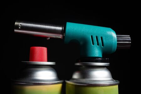 Photo of a gas jet instrument with cans.の写真素材