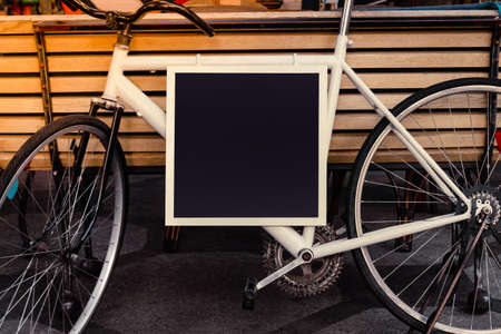 Photo of a cafe board street sign made of bicycle.の写真素材