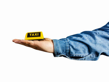 Photo of isolated male hand in shirt holding taxi sign profile view.の写真素材