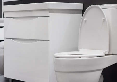 Photo of bathroom table and toilet close-up.
