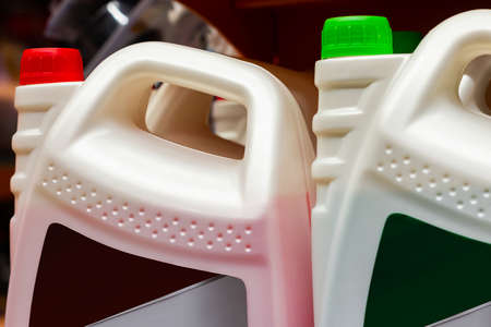 auto liquid canisters standing on store shelf.の写真素材