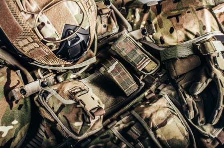 level 3 protection soldier ammunition and helmet laying on table surface.