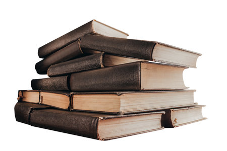 Isolated photo of old fashioned stack of books on white background.の写真素材