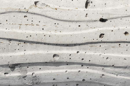 Texture photo of grey colored concrete backdrop with wavy pattern on it.の写真素材