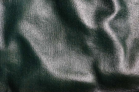 Texture backdrop photo of green colored folded leather material.の写真素材