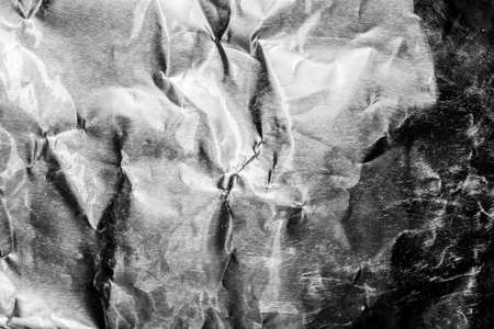 Texture backdrop photo of silver metal crumbled foil.の写真素材