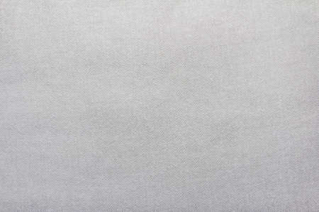 Texture backdrop photo of white colored denim or jeans cloth.