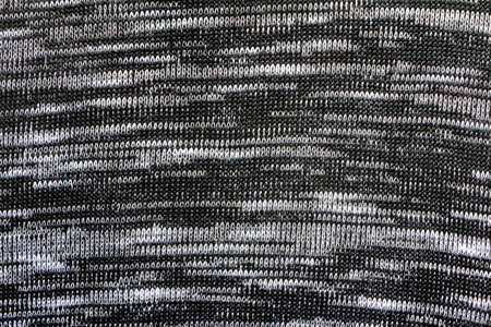 Texture backdrop photo of grey pattern colored polyester interlock knitted fabric cloth.
