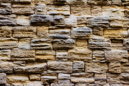 Photo texture of old and ancient stone wall.の写真素材