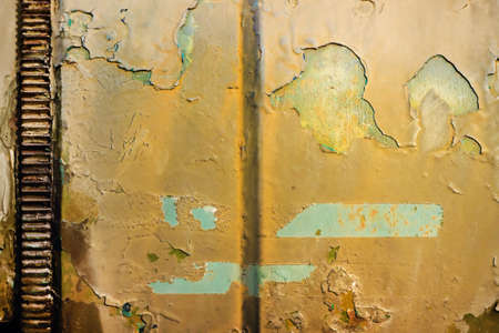 Photo of old and rusty military vehicle armored surface plate.