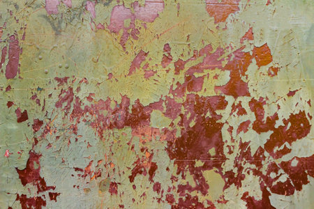 Photo of old and rusty green colored military vehicle armored surface plate.