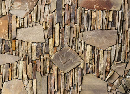 Texture photo of brown colored stone wall tile.