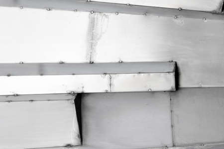 Texture photo of stainless steel armored black and white scratched surface plates.の写真素材