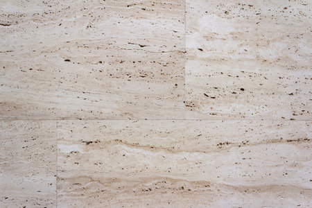 Texture photo of beige colored stone wall blocks.の写真素材