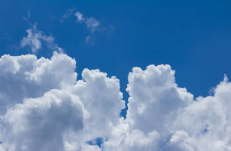 Photo of white fluffy clouds on daylight blue sky.の写真素材