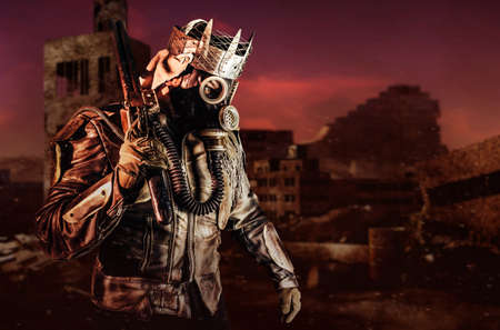 Photo of fantasy post apocalyptic warrior with armored outfit jacket and scrap crown standing with rifle on destroyed city background.の写真素材