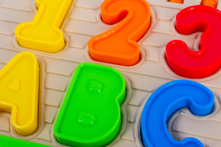 Close up photo of kids toy multi colored numbers and alphabet letters.の写真素材